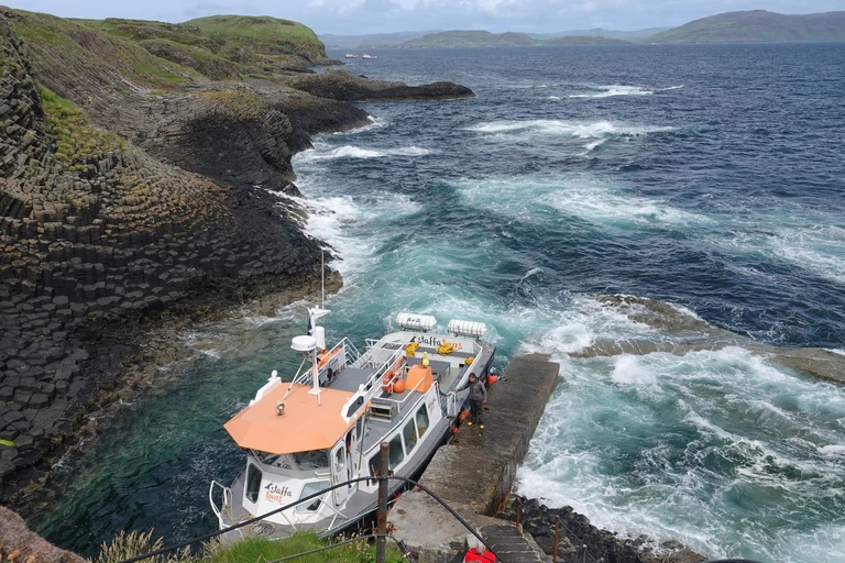Step off a boat onto an island of basalt columns