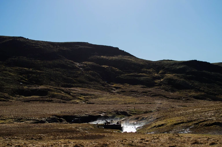 Bathe in a river that runs hot out of a hillside