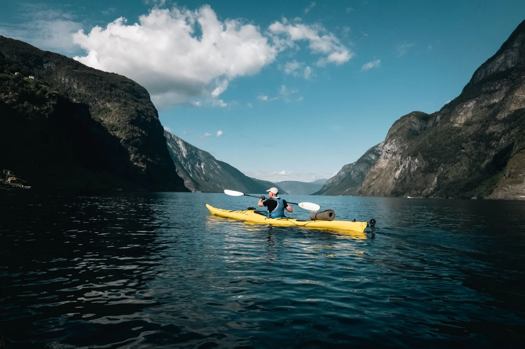 Paddle a fjord a quarter of a kilometer wide with a thousand meters of rock on either side