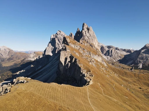 The Seceda ridge and its spires seen from above in clear weather.