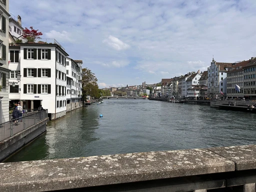 A picturesque view of the Limmat River and historic buildings in Zürich, Switzerland.