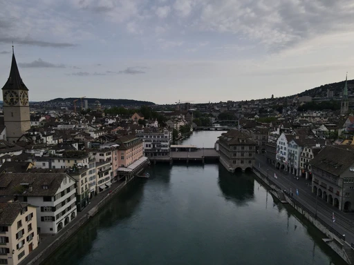 A stunning aerial perspective showcasing Zurich's iconic Limmat River and historic architecture.