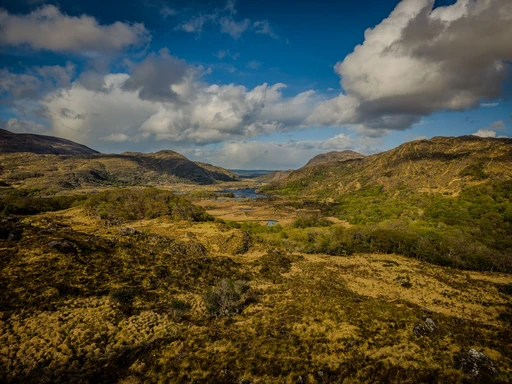 Breathtaking landscape in Killarney, Ireland, showcasing vibrant spring foliage and majestic hills.