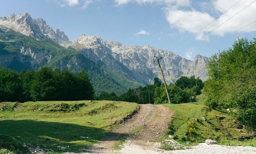 Captivating view of Valbonë mountains with lush green landscape in Albania.