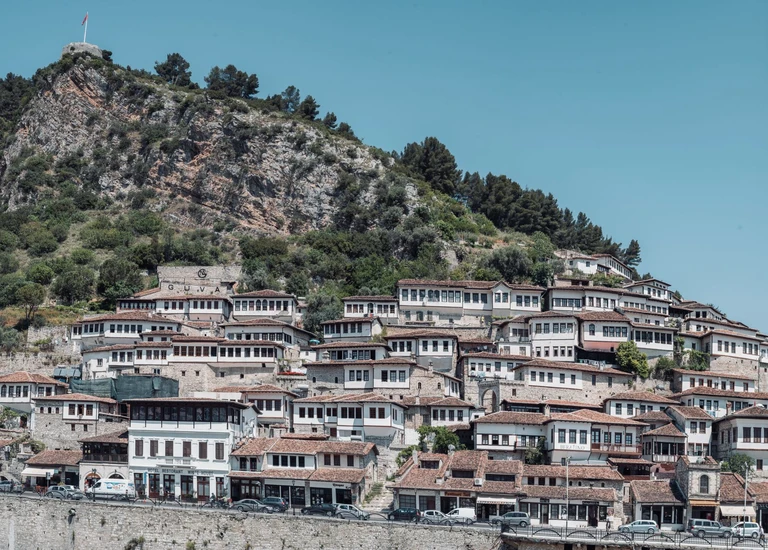 Count the windows stacked up a hillside in Berat