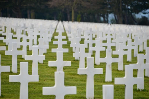 Rows of white marble crosses on the lawn of the Normandy American Cemetery.
