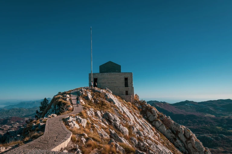 Climb a tunnel inside a mountain to a tomb on its summit