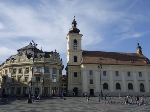 The Great Square in Sibiu's old town, ringed by colorful historic buildings.