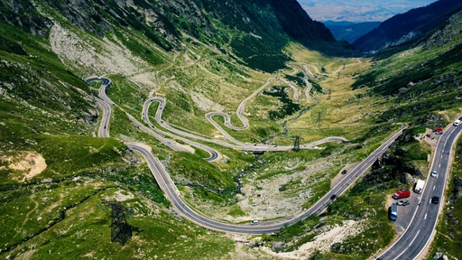 Aerial view of the Transfăgărășan road curving across the Făgăraș mountains.