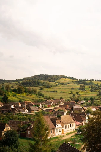 Aerial view of Biertan village and its fortified church on the hill.