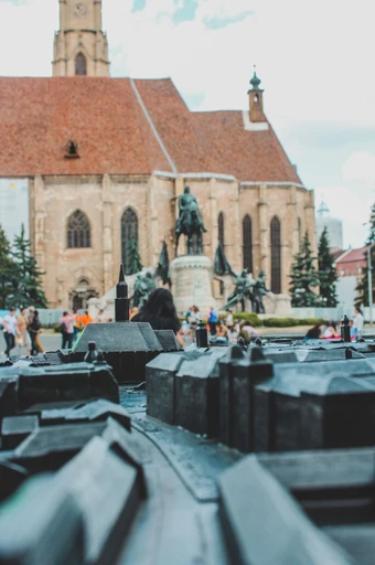 St Michael's Church and the Matthias Corvinus statue in Cluj-Napoca's main square.