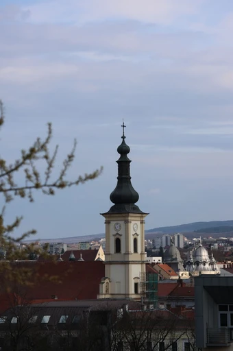 A baroque tower over the Cluj-Napoca skyline.