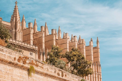The flying buttresses and pinnacles of Palma Cathedral seen from close to the wall.