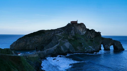 Stunning ocean view of Gaztelugatxe island with rocky formations in Spain.