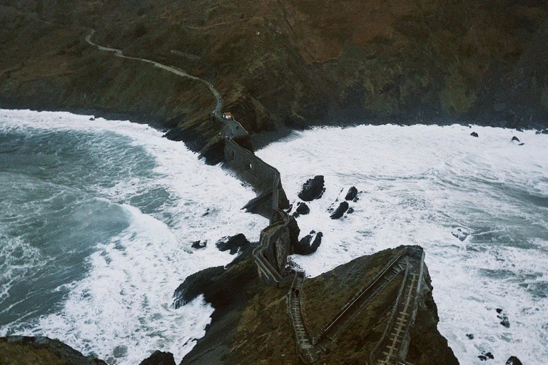 Climb the steps to a hermitage on a rock in the sea