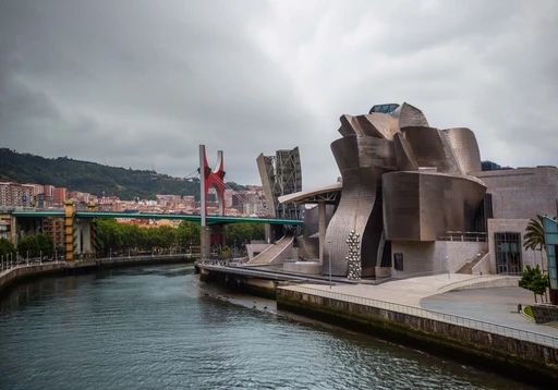 A stunning view of the Guggenheim Museum and Zubizuri bridge in Bilbao, Spain, showcasing modern architecture.