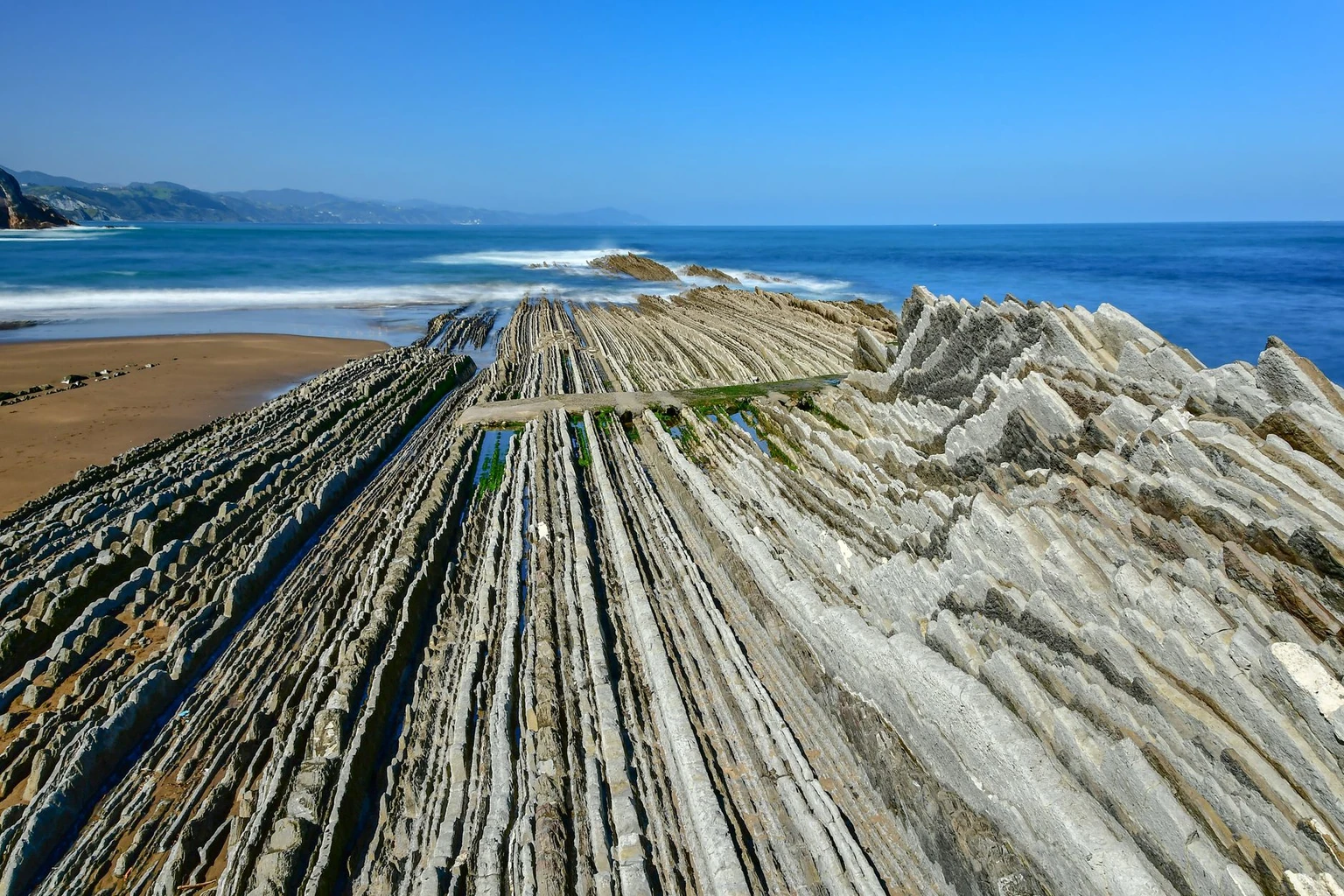 A stunning aerial view of Zumaya's unique flysch rock formations along the Spanish coastline.