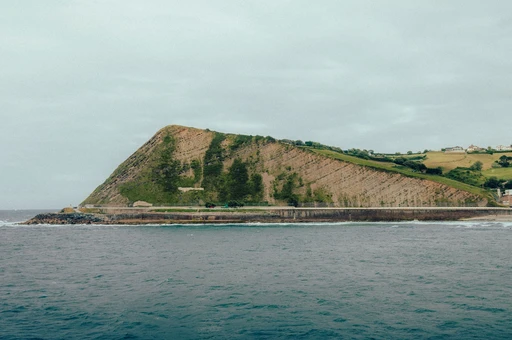 A stunning coastal landscape in Zumaia, Spain, showcasing unique rock formations and the serene ocean.