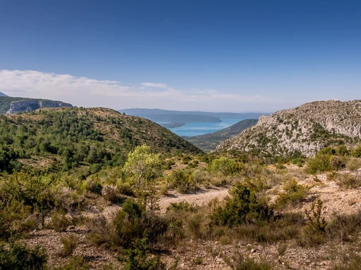 Hills and the blue lake seen from the high ground above Moustiers-Sainte-Marie.