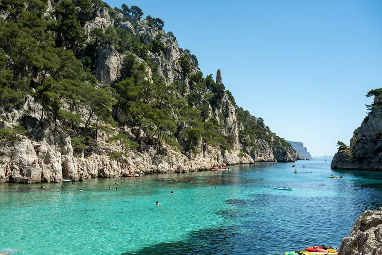 Swim off the side of a boat in a calanque