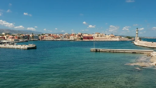 The Venetian port of Chania by day, with harborside buildings and the lighthouse.
